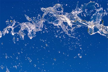 simsearch:400-05683853,k - Fresh water SPLASH - water drops floating in the air Foto de stock - Super Valor sin royalties y Suscripción, Código: 400-04470231