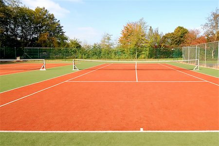 empty tennis court - tennis court under blue sky, with autumn trees on the side. Stock Photo - Budget Royalty-Free & Subscription, Code: 400-04470348