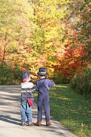 rural american and family - Two Boys Walking Down Road To Fish in the Fall Stock Photo - Budget Royalty-Free & Subscription, Code: 400-04470778