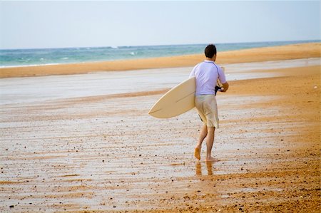 surfers men model - Surfer walking on the beach. Horizontal shot. Stock Photo - Budget Royalty-Free & Subscription, Code: 400-04471299