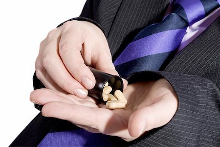 Businessman addicted to pills. Stock Photo - Budget Royalty-Free & Subscription, Code: 400-04471462