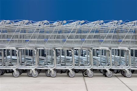 sparky2000 (artist) - A line of shopping carts against a blue wall. Photographie de stock - Aubaine LD & Abonnement, Code: 400-04471999