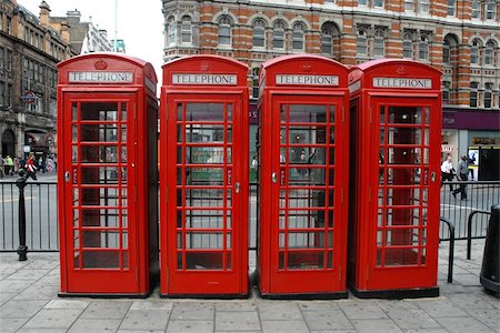 red call box - Row of four of England's classic design of telephone boxes Photographie de stock - Aubaine LD & Abonnement, Code: 400-04472132