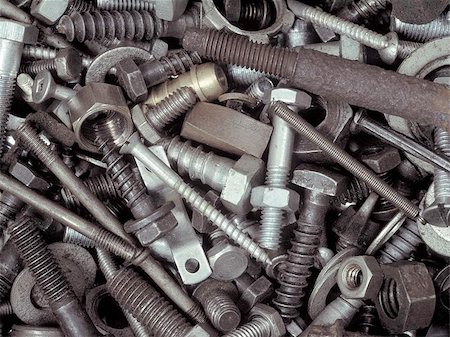 pile of metal springs - An assortment of bolts, screws, nuts, washers and all kinds of other fasteners piled in a toolbox. Stock Photo - Budget Royalty-Free & Subscription, Code: 400-04472329