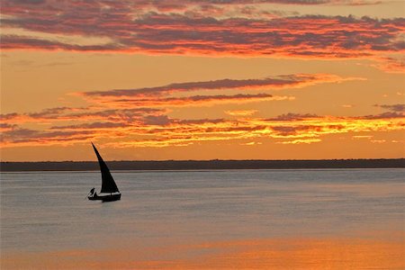 dhow - Beach sunset scene in Mozambique with small sailboat (called a dhow) Stock Photo - Budget Royalty-Free & Subscription, Code: 400-04472476