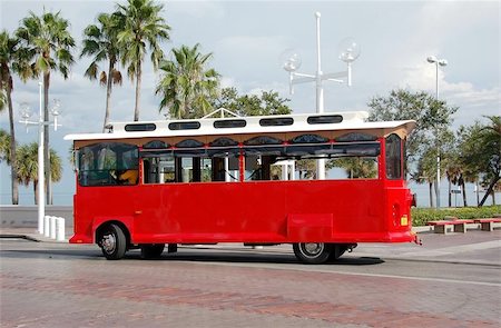 Red sightseeing trolley in tropical destination Stock Photo - Budget Royalty-Free & Subscription, Code: 400-04473240