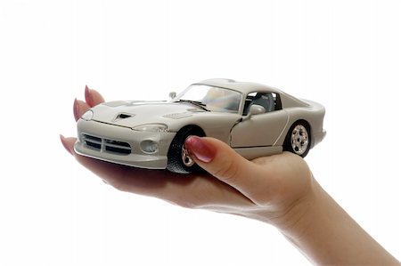 Car toy on palm Photographie de stock - Aubaine LD & Abonnement, Code: 400-04473715