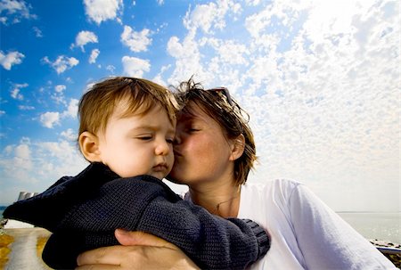 wide-angle shot of mother and son done with reflector over clouds. Stock Photo - Budget Royalty-Free & Subscription, Code: 400-04473729