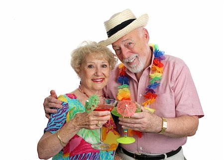 simsearch:400-08040653,k - An attractive senior couple on vacation drinking tropical drinks with little umbrellas.  Isolated. Stock Photo - Budget Royalty-Free & Subscription, Code: 400-04484001