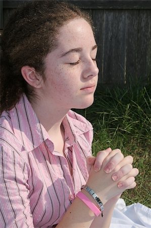 A cute teen girl praying toward heaven. Stock Photo - Budget Royalty-Free & Subscription, Code: 400-04484122