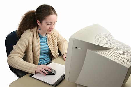 A teen girl doing computer graphics using a mouse and graphics tablet. Foto de stock - Super Valor sin royalties y Suscripción, Código: 400-04484715