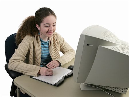 A girl smiling as she draws with a graphics tablet at the computer. Foto de stock - Super Valor sin royalties y Suscripción, Código: 400-04484725