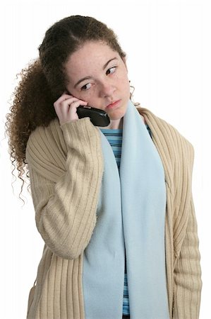 A cute teen girl talking on a cell phone with an angry expression.  Isolated. Stock Photo - Budget Royalty-Free & Subscription, Code: 400-04484767