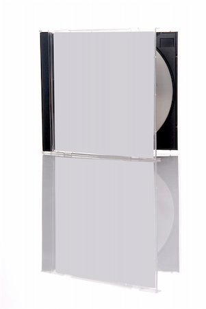 simsearch:400-03950272,k - a compact disc in the box, isolated on white background with reflection Photographie de stock - Aubaine LD & Abonnement, Code: 400-04484953