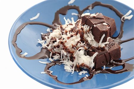 A closeup of a chocolate and coconut dessert over white. Stock Photo - Budget Royalty-Free & Subscription, Code: 400-04485046
