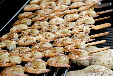 food for the fourth - A closeup view of shrimp on skewers grilling on the barbecue. Stock Photo - Budget Royalty-Free & Subscription, Code: 400-04485053