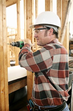 simsearch:400-03971056,k - A carpenter on a construction site drilling safely according to safty codes and regulations. Foto de stock - Super Valor sin royalties y Suscripción, Código: 400-04485128