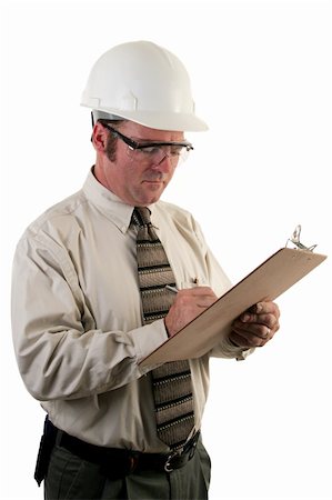 simsearch:400-05714957,k - a construction safety inspector with safety goggles and a hard hat inspecting a jobsite Stock Photo - Budget Royalty-Free & Subscription, Code: 400-04485149