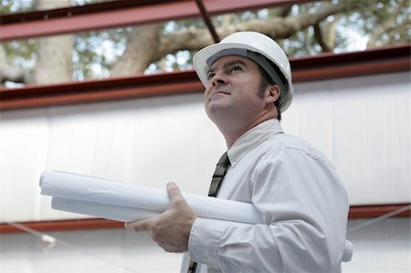 simsearch:400-04485397,k - An engineer or architect holding blueprints surveying his project.  Building is steel frame construction. Stock Photo - Budget Royalty-Free & Subscription, Code: 400-04485202