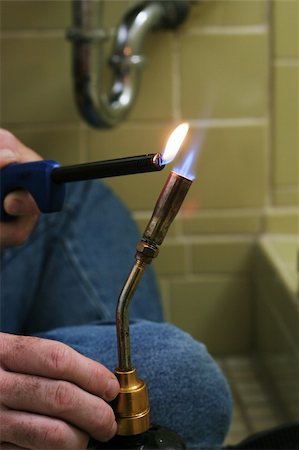 plumbing leak - A closeup of a welding torch being lighted. Stock Photo - Budget Royalty-Free & Subscription, Code: 400-04485226