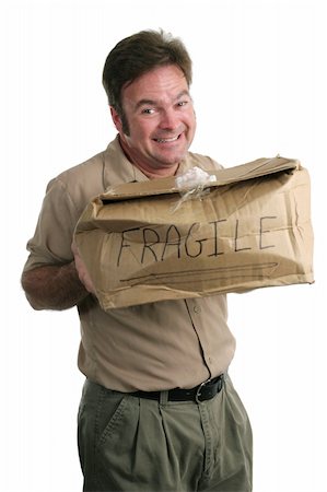 A guilty looking delivery man holding a smashed package. Stock Photo - Budget Royalty-Free & Subscription, Code: 400-04485239