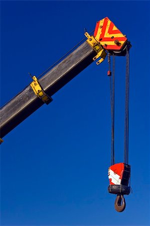 simsearch:400-04422019,k - Crane with hook against blue sky Fotografie stock - Microstock e Abbonamento, Codice: 400-04485296