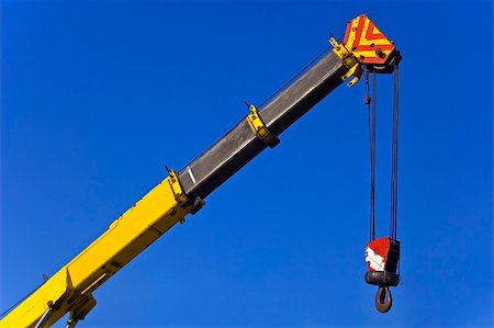 simsearch:400-04422019,k - Crane with hook against blue sky Fotografie stock - Microstock e Abbonamento, Codice: 400-04485297