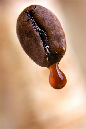 simsearch:400-06077206,k - Drop of coffee dripping from coffee seed. Shallow depth of field. Clipping path included. Photographie de stock - Aubaine LD & Abonnement, Code: 400-04485368