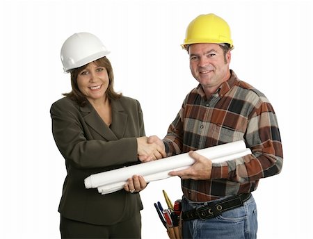 A female engineer and a building contractor shaking hands.  Isolated on white. Stock Photo - Budget Royalty-Free & Subscription, Code: 400-04485403