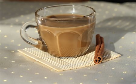 stephconnell (artist) - a cup of coffee with a cinnamon stick Foto de stock - Super Valor sin royalties y Suscripción, Código: 400-04485659