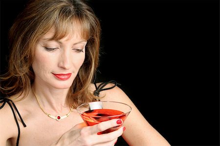 A beautiful, sophisticated woman relaxing with a cocktail. Stock Photo - Budget Royalty-Free & Subscription, Code: 400-04485698