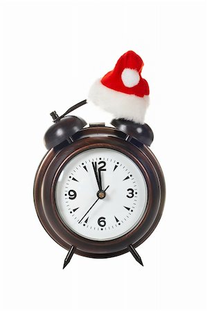 simsearch:700-05974049,k - Alarm clock with christmas hat, isolated over white background Stock Photo - Budget Royalty-Free & Subscription, Code: 400-04485737