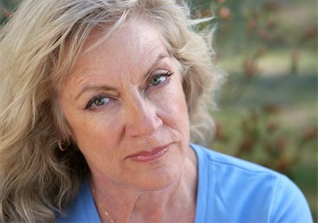 A beautiful mature woman looking hurt and distrustful. Stock Photo - Budget Royalty-Free & Subscription, Code: 400-04486137