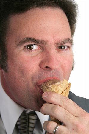 excited ice cream - A closeup of a businessman eating ice cream. Stock Photo - Budget Royalty-Free & Subscription, Code: 400-04486174