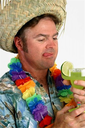 person in hawaiian shirt - A drunk tourist looking  thirsty at a margarita. Stock Photo - Budget Royalty-Free & Subscription, Code: 400-04486195