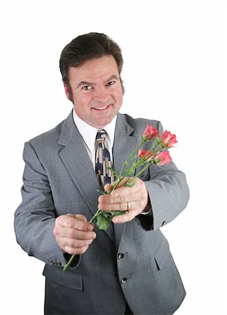 simsearch:400-04486211,k - A husband apologizing to his wife by offering her pink roses. Stockbilder - Microstock & Abonnement, Bildnummer: 400-04486205