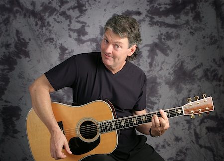 simsearch:400-03972483,k - A handsome, middle aged guitarist. Stock Photo - Budget Royalty-Free & Subscription, Code: 400-04486293