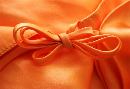 simsearch:400-07634587,k - Silk textile background with a bow Stock Photo - Budget Royalty-Free & Subscription, Code: 400-04486469