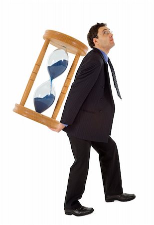Businessman carrying a hourglass - concept for working under the pressure of a deadline - isolated Stock Photo - Budget Royalty-Free & Subscription, Code: 400-04486470