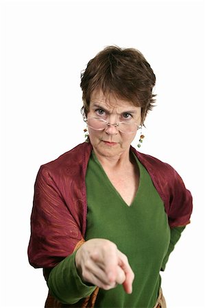 simsearch:640-02656814,k - A bossy, angry looking middle aged woman pointing her finger at you.  Isolated on white.   Note to inspector:  Velour texture of the shirt may resemble artifacting. Photographie de stock - Aubaine LD & Abonnement, Code: 400-04486600