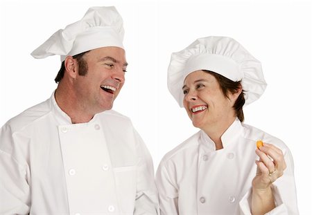 A male and female chef laughing together.  Isolated on white. Stock Photo - Budget Royalty-Free & Subscription, Code: 400-04486613