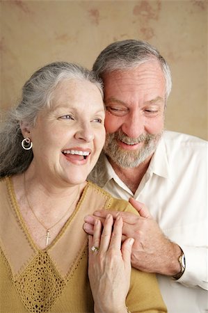 simsearch:400-03972903,k - A beautiful gray haired couple in their sixties laughing together.  Focus on wife. Stock Photo - Budget Royalty-Free & Subscription, Code: 400-04486660