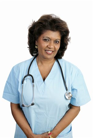 A compassionate doctor or nurse in blue scrubs.  Isolated on white. Stock Photo - Budget Royalty-Free & Subscription, Code: 400-04486676