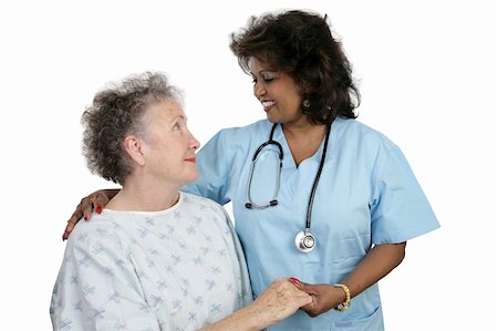 An elderly patient and a caring nurse or doctor.  Isolated on white. Stock Photo - Budget Royalty-Free & Subscription, Code: 400-04486685