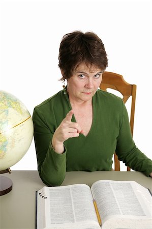 A stern looking teacher or librarian shaking her finger at you.  Isolated on white. Note to inspector:  Texture of velour shirt may appear as artifacts. Stock Photo - Budget Royalty-Free & Subscription, Code: 400-04486698