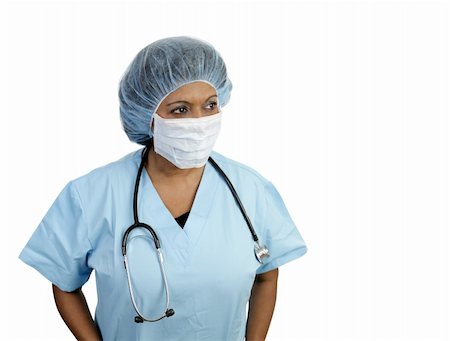 A doctor in surgical scrubs with hairnet and mask.  Isolated with room for text. Stock Photo - Budget Royalty-Free & Subscription, Code: 400-04486700