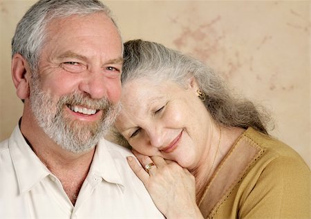 simsearch:400-04109826,k - A beautifull middle aged couple being affectionate with each other.  Focus on her. Fotografie stock - Microstock e Abbonamento, Codice: 400-04486702