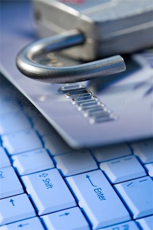 Credit card, lock, and a computer laptop keyboard for safety and security on the internet Stock Photo - Budget Royalty-Free & Subscription, Code: 400-04487142