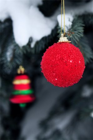 Christmas ornaments hanging on snow covered spruce tree outside Stock Photo - Budget Royalty-Free & Subscription, Code: 400-04487260