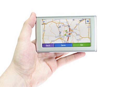 driver with map - GPS VEHICLE NAVIGATION SYSTEM IN A MAN HAND ISOLATED ON WHITE Stock Photo - Budget Royalty-Free & Subscription, Code: 400-04487969